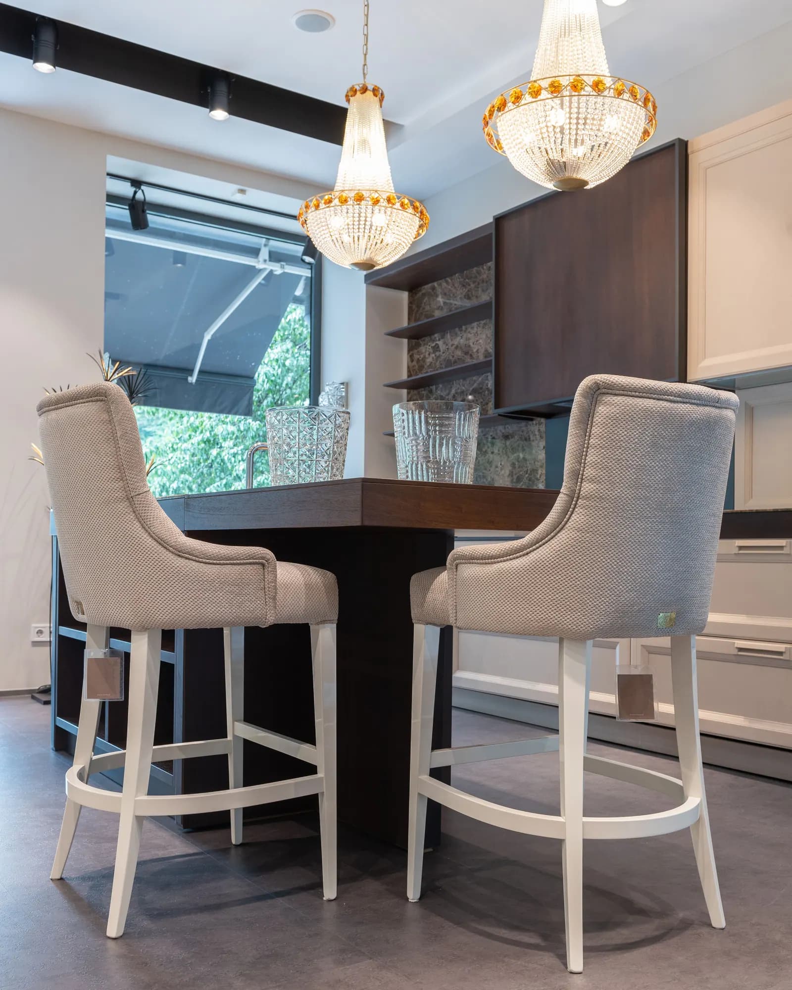 Light modern dining space with chairs and chandelier — design inspiration